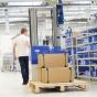 Balanseri s užetom i mobilni podizači. Prenosivo rešenje za pripremu paketa do 50 kg
